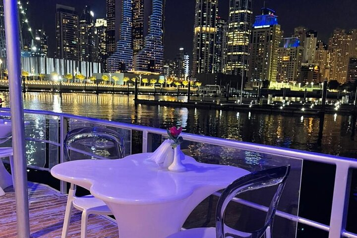 Savor stunning views of Dubai Marina's skyline as you enjoy a delightful dinner cruise surrounded by iconic landmarks and the shimmering waters of this luxurious waterfront community.